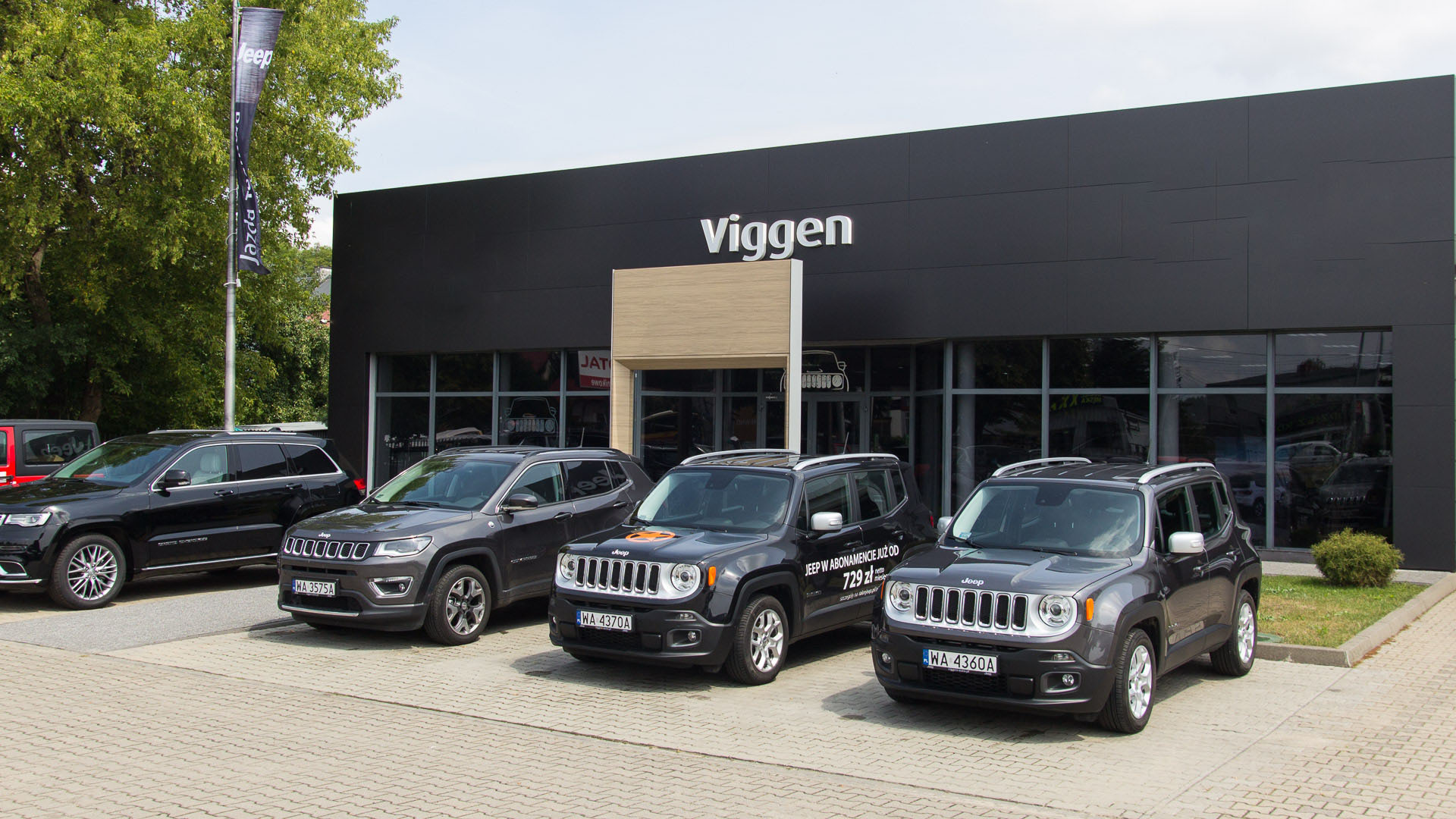 Viggen Auto - budynek serwisu i samochody przed salonem